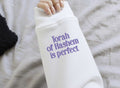 Sweatshirt with "Torah of Hashem is perfect" embroidered on a sleeve
